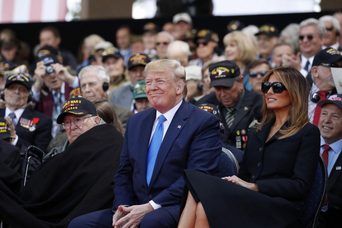 President Donald Trump and First Lady Melania Trump participate in a ceremony to commemorate the 75th anniversary of D-Day at the American Normandy cemetery in Colleville-sur-Mer, Normandy, France, on June 6, 2019. (AP Photo/Alex Brandon)