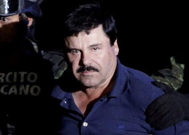 Recaptured drug lord Joaquin "El Chapo" Guzman is escorted by soldiers at the hangar belonging to the office of the Attorney General in Mexico City, Mexico, on Jan. 8, 2016. (Henry Romero/Reuters)