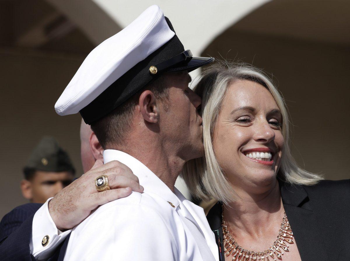 Navy Special Operations Chief Edward Gallagher, left, kisses his wife, Andrea Gallagher after leaving a military court on Naval Base San Diego, July 2, 2019, in San Diego. (AP Photo/Gregory Bull)