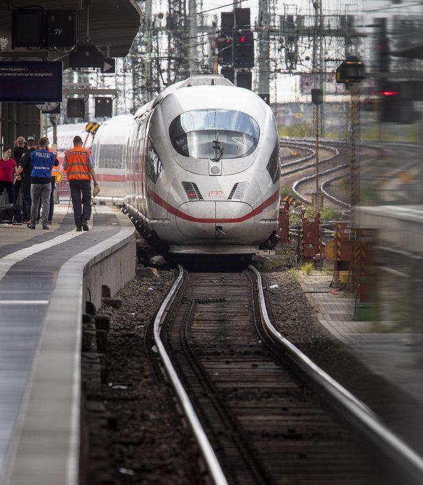 A police officer walks next to an ICE highspeed train at the main station in Frankfurt, Germany on July 29, 2019. (AP Photo/Michael Probst)