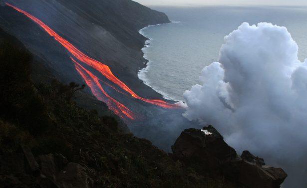 The flanks of the Stromboli volcano north of Sicily spews lava towards the sea on Feb. 28, 2007. (Mario Laporta/AFP/Getty Images)
