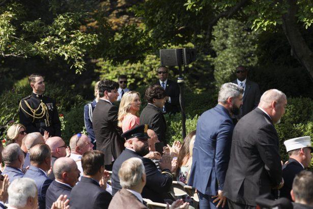 Family members of deceased New York City detective Luis Alvarez attend President Donald Trump's signing of the 9/11 Victim Compensation Fund bill in the White House Rose Garden on July 29, 2019. (Charlotte Cuthbertson/The Epoch Times)