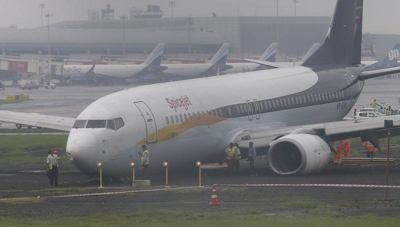 A domestic flight that skidded off the main runway late Monday night during heavy monsoon rains is seen at the Mumbai airport in Mumbai, India on July 2, 2019. (Rafiq Maqbool/AP Photo)