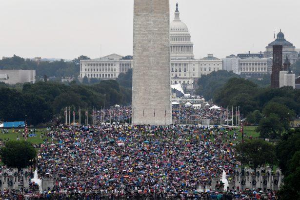 People gather on the National Mall as they wait for President Donald Trump to speak at the Lincoln Memorial in Washington on July 4, 2019. (Susan Walsh/AFP/Getty Images)