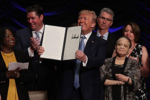 President Donald Trump displays an executive order he signed during an event on kidney health in Washington on July 10, 2019. (Alex Wong/Getty Images)