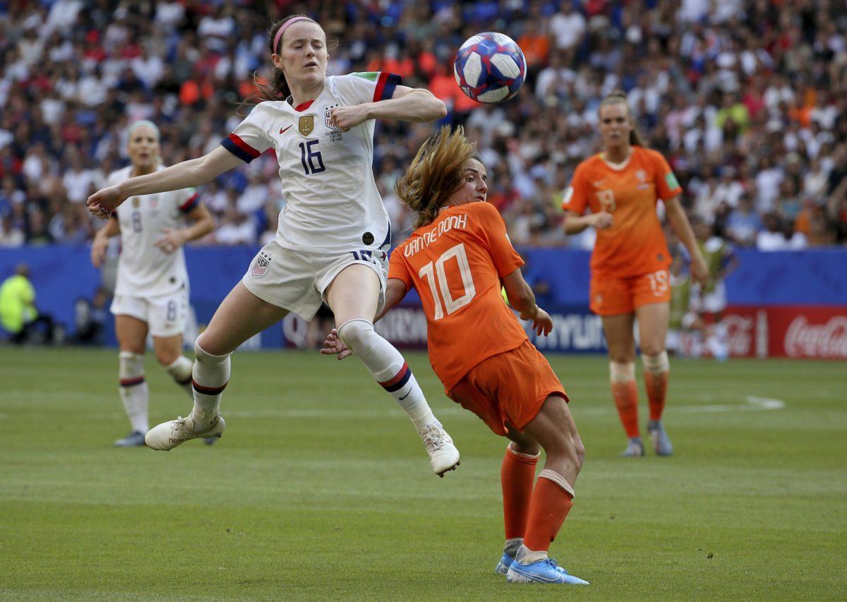 United States' Rose Lavelle, left, is challenged by Netherlands' Danielle Van De Donk during the Women's World Cup final soccer match between the US and The Netherlands at the Stade de Lyon in Decines, outside Lyon, France, on July 7, 2019. (David Vincent/AP Photo)