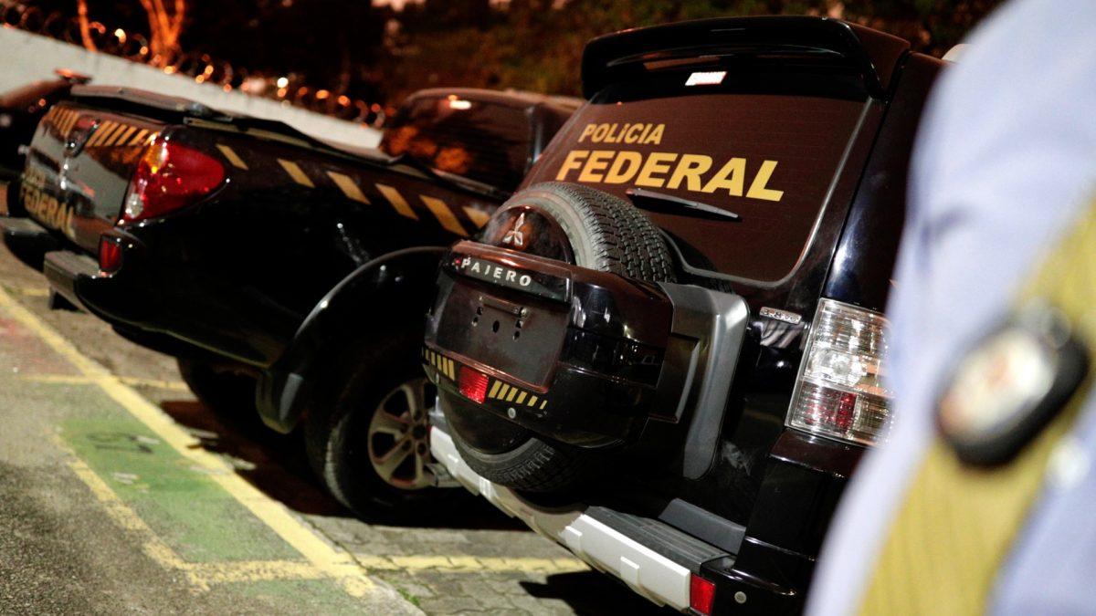 A view of pickup trucks with livery resembling Brazil's federal police inside the DEIC (State Criminal Investigation Department), which were used by the thieves during the theft at Guarulhos airport in Sao Paulo, Brazil on July 25, 2019. (Nacho Doce/Reuters)