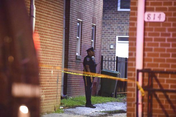 A Baltimore City police officer block stands near the scene of a shooting in Baltimore on Sept. 23, 2018. (Kenneth K. Lam/The Baltimore Sun via AP)