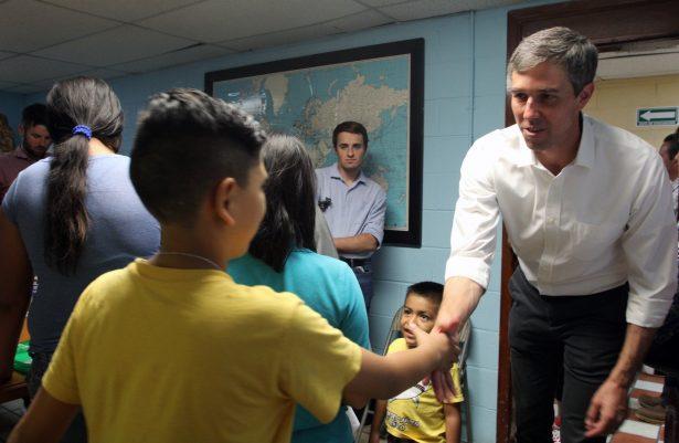 Former congressman and presidential candidate hopeful for the Democratic Party, Beto O'Rourke, right, shakes hands with a Central American migrant child during a visit at the "House of the migrant" shelter in Ciudad Juarez, Chihuahua State, Mexico on June 30, 2019. (Herika Martinez/AFP/Getty Images)