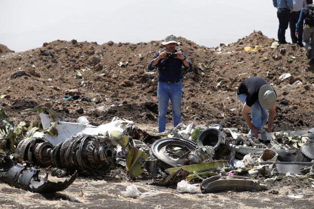 American civil aviation and Boeing investigators search through the debris at the scene of the Ethiopian Airlines Flight ET 302 plane crash, near the town of Bishoftu, southeast of Addis Ababa, Ethiopia, on March 12, 2019. (Baz Ratner/Reuters)