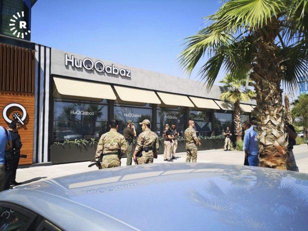 An Irbil-based Kurdish broadcaster, shows security forces at the scene of a shooting outside a restaurant in Irbil, Iraq, on July 17, 2019. (Rudaw Facebook TV via AP)