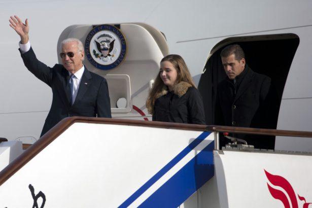 Vice President Joe Biden waves as he walks out of Air Force Two with his granddaughter Finnegan Biden (C) and son Hunter Biden (R) at the airport in Beijing, China on Dec. 4, 2013. (Ng Han Guan-Pool/Getty Images)