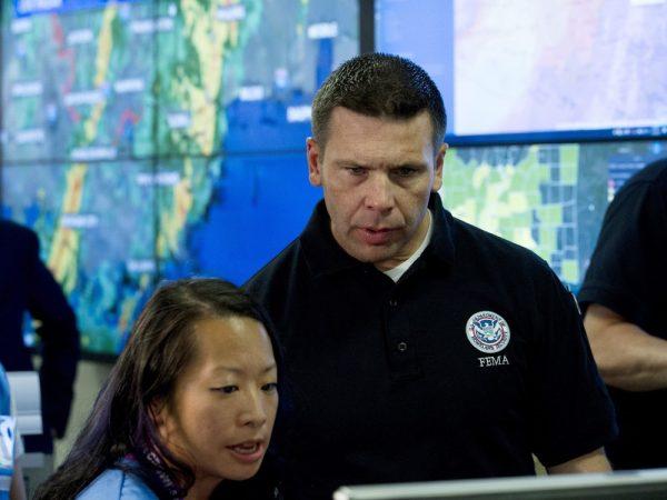 Acting Homeland Security Secretary Kevin McAleenan speaks with FEMA personnel, as he gets information about a storm system, in a visit to the National Response Coordination Center at FEMA headquarters in Washington, on July 14, 2019. (Jose Luis Magana/AP Photo)