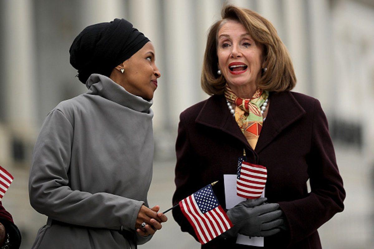 Rep. Ilhan Omar (D-MN) (L) talks with Speaker of the House Nancy Pelosi (D-CA) during a rally with fellow Democrats before voting on H.R. 1, or the People Act, on the East Steps of the U.S. Capitol in Washington, on March 08, 2019. (Chip Somodevilla/Getty Images)