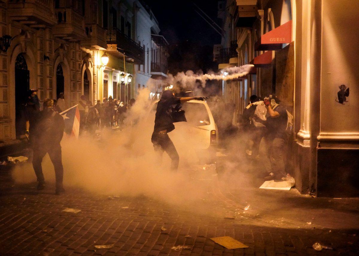 Protesters clash with police in San Juan, Puerto Rico, on July 17, 2019. (Eric Rojas/AFP/Getty Images)