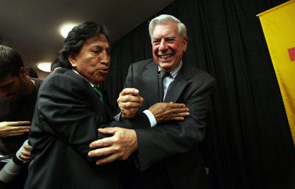 Peruvian writer Mario Vargas Llosa (R) is hugged by former Peruvian President Alejandro Toledo at a press conference at Instituto Cervantes after Llosa won the 2010 Nobel Prize in literature in New York City on Oct. 7, 2010. (Mario Tama/Getty Images)