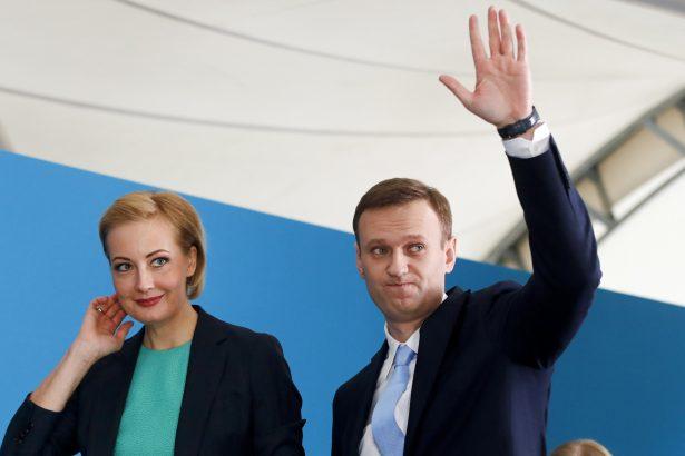 Russian opposition leader Alexei Navalny and his wife Yulia attend his supporters' meeting that nominated him for the presidential election race in Moscow, Russia. (Pavel Golovkin/AP Photo)