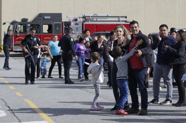 Shoppers hug after being escorted from the Tanforan Mall in San Bruno, Calif., on July 2, 2019. (Stephanie Mullen/AP Photo)
