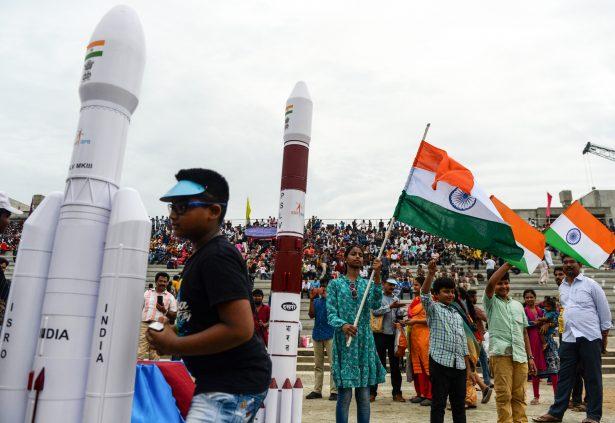 Students wave Indian national flags as the Indian Space Research Organisation's (ISRO) Chandrayaan-2 (Moon Chariot 2), with on board the Geosynchronous Satellite Launch Vehicle (GSLV-mark III-M1), has been launched in Sriharikota in the state of Andhra Pradesh on July 22, 2019. (Arun Sankar/AFP/Getty Images)