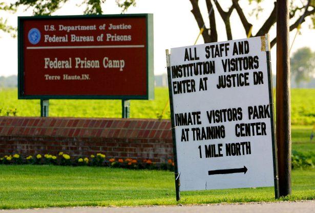 A directional sign in seen in a file photograph near the entrance to the grounds of the U.S. Federal Prison in Terre Haute, Ind. (Tim Boyle/Getty Images)