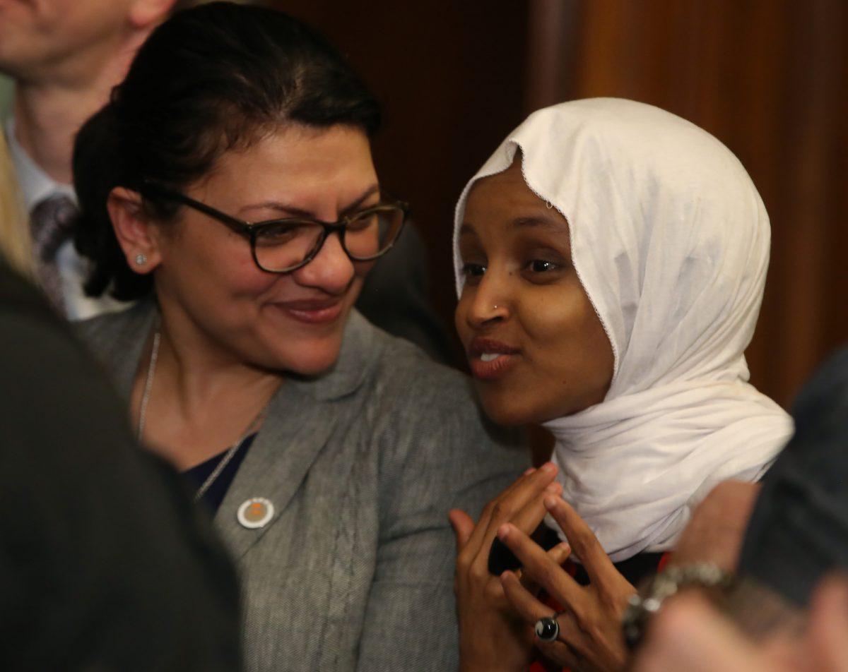 Rep. Rashida Tlaib (D-Mich.), left, and Rep. Ilhan Omar (D-Minn.) attend a news conference in Washington on March 13, 2019. (Photo by Mark Wilson/Getty Images)
