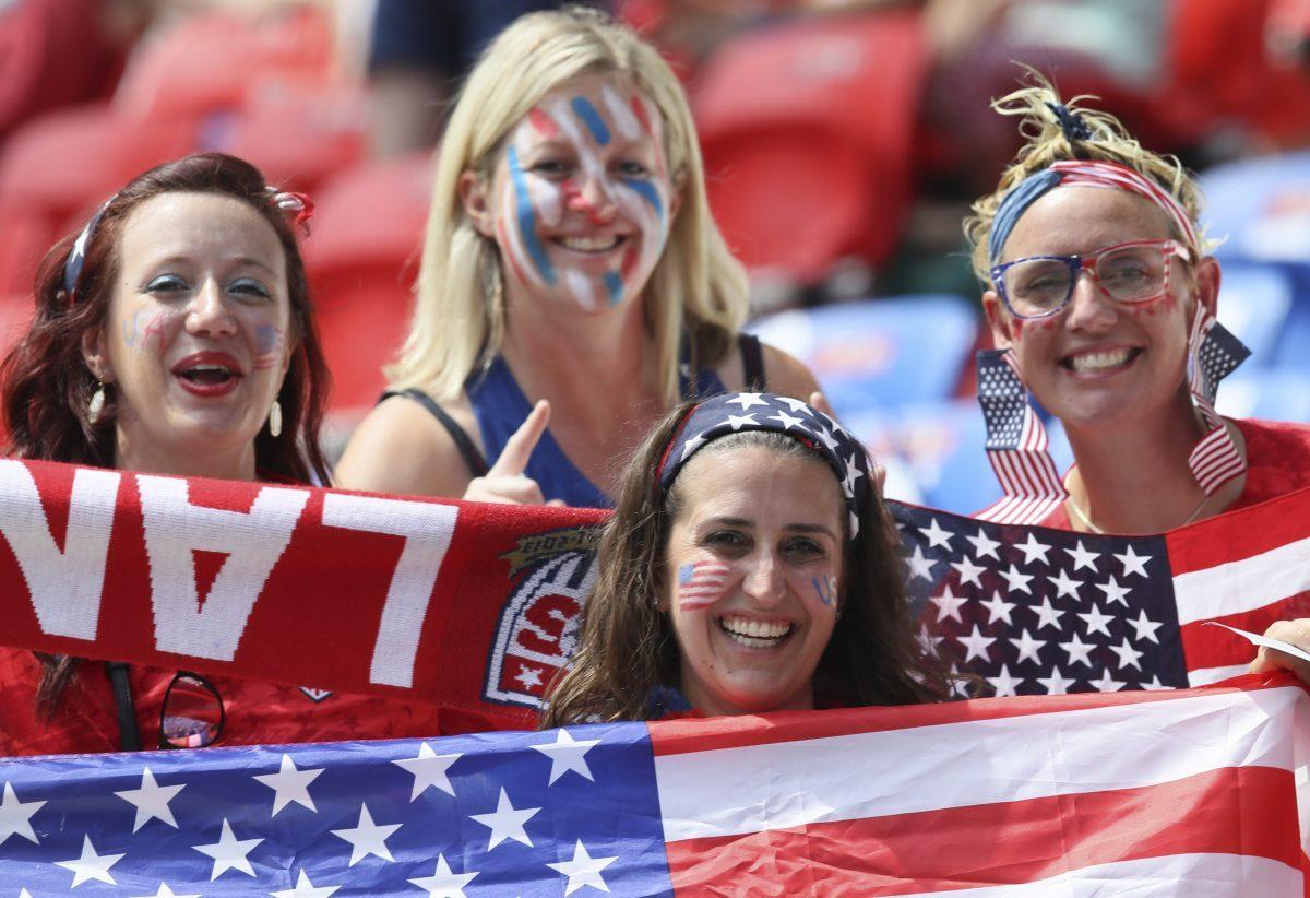 Supporters cheer at stands prior to the Women's World Cup final soccer match between US and The Netherlands at the Stade de Lyon in Decines, outside Lyon, France, on July 7, 2019. (David Vincent/AP Photo)