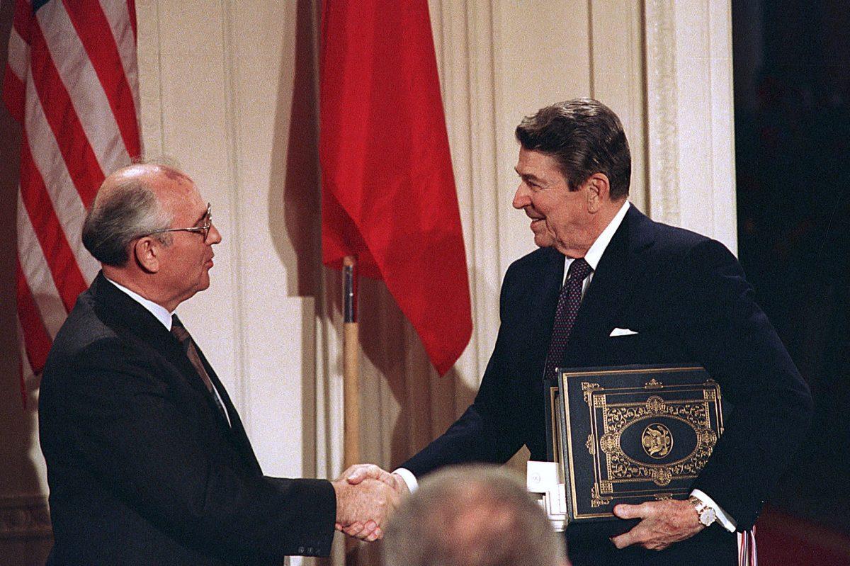 In this Dec. 8, 1987, file photo, President Ronald Reagan, right, shakes hands with Soviet leader Mikhail Gorbachev after the two leaders signed the Intermediate Range Nuclear Forces Treaty to eliminate intermediate-range missiles during a ceremony in the White House East Room in Washington. (AP Photo/Bob Daugherty, File)