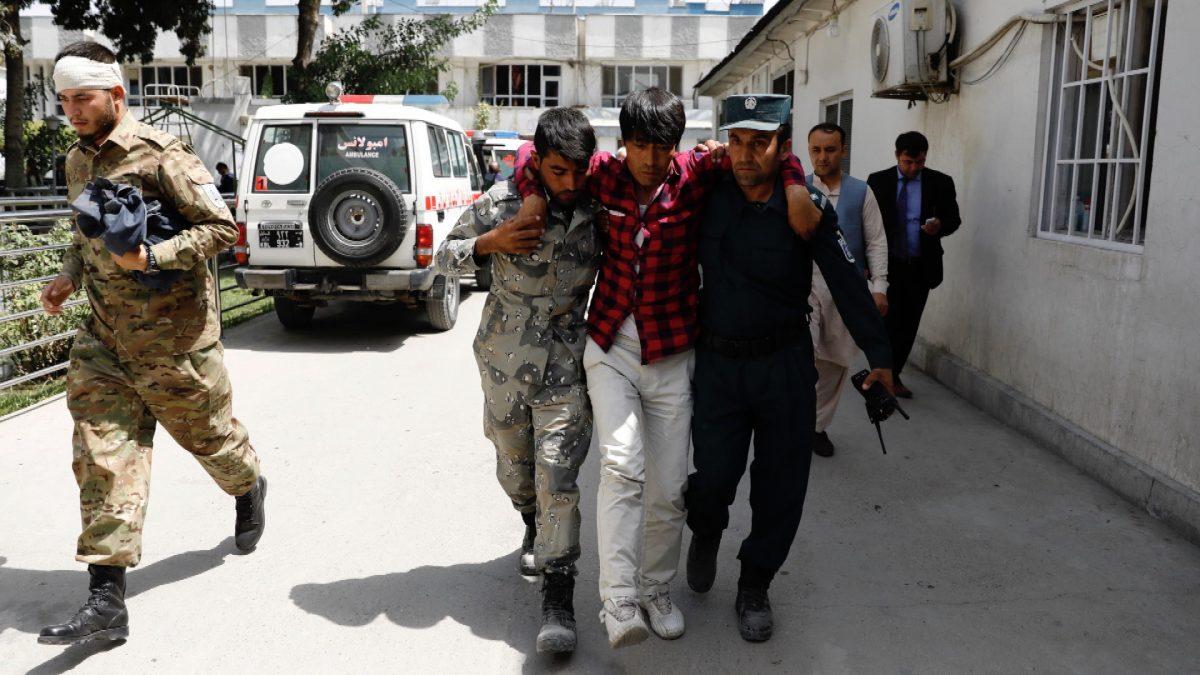 Men carry an injured man to a hospital after a blast in Kabul, Afghanistan on Aug. 7, 2019. (Mohammad Ismail/Reuters)