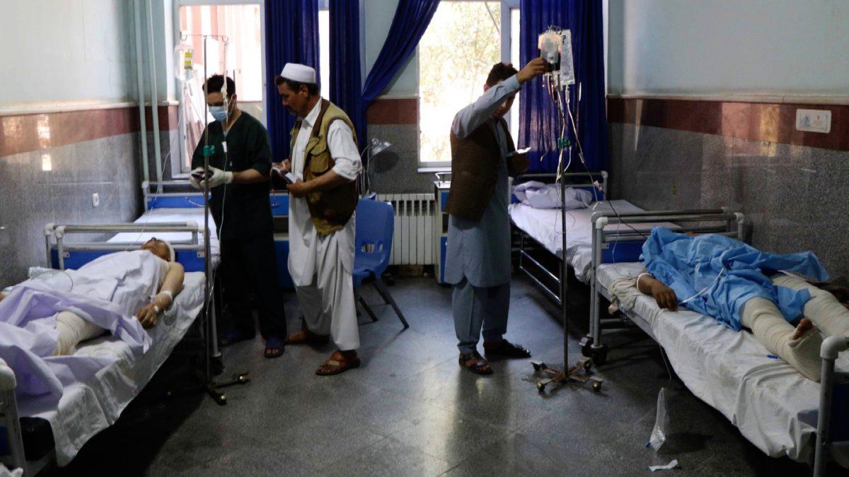 Afghan men receive treatment at a hospital after a bus was hit by a roadside bomb in Herat province, western Afghanistan on July 31, 2019. (Jalil Ahmad/File Photo via Reuters)