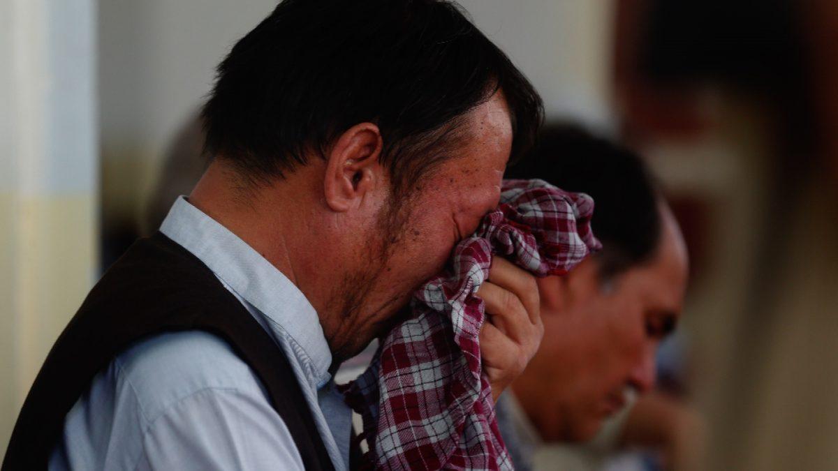 Men mourn for the victims of the Dubai City wedding hall bombing during a memorial service at a mosque in Kabul, Afghanistan on Aug. 20, 2019. (Rafiq Maqbool/AP Photo)