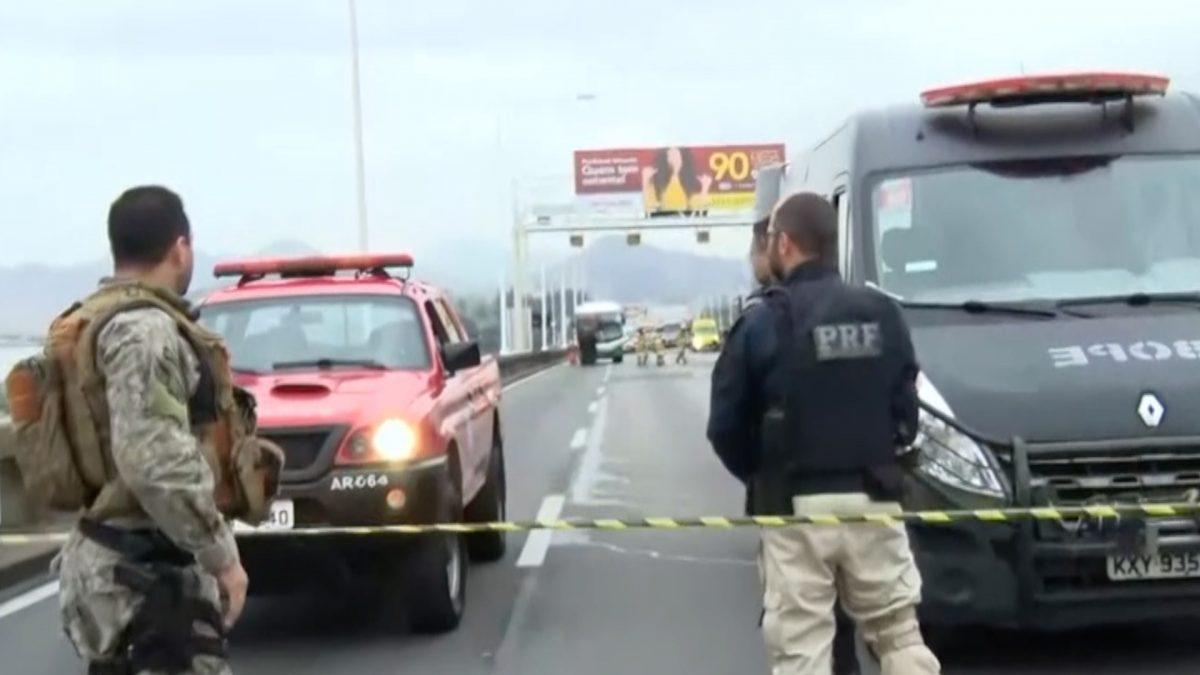 Armed military police block the Rio-Niteroi Bridge, where armed police surrounded a hijacked passenger bus in Rio de Janeiro, Brazil on Aug. 20, 2019. (Still Image from RECORD TV video)