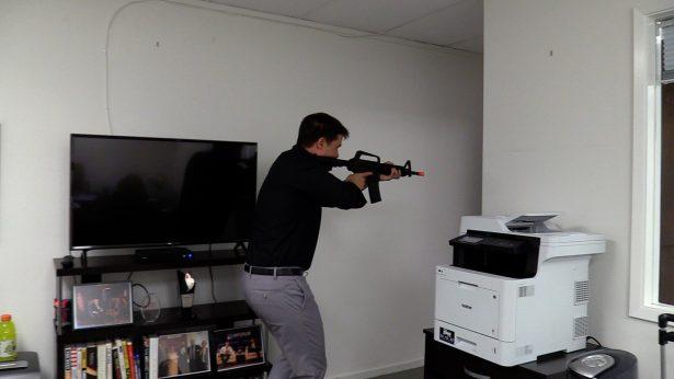 Brad Engmann pretends to be a shooter looking for targets in an office space in Walnut Creek, California, on Aug. 6, 2019. (Ilene Eng/NTD)