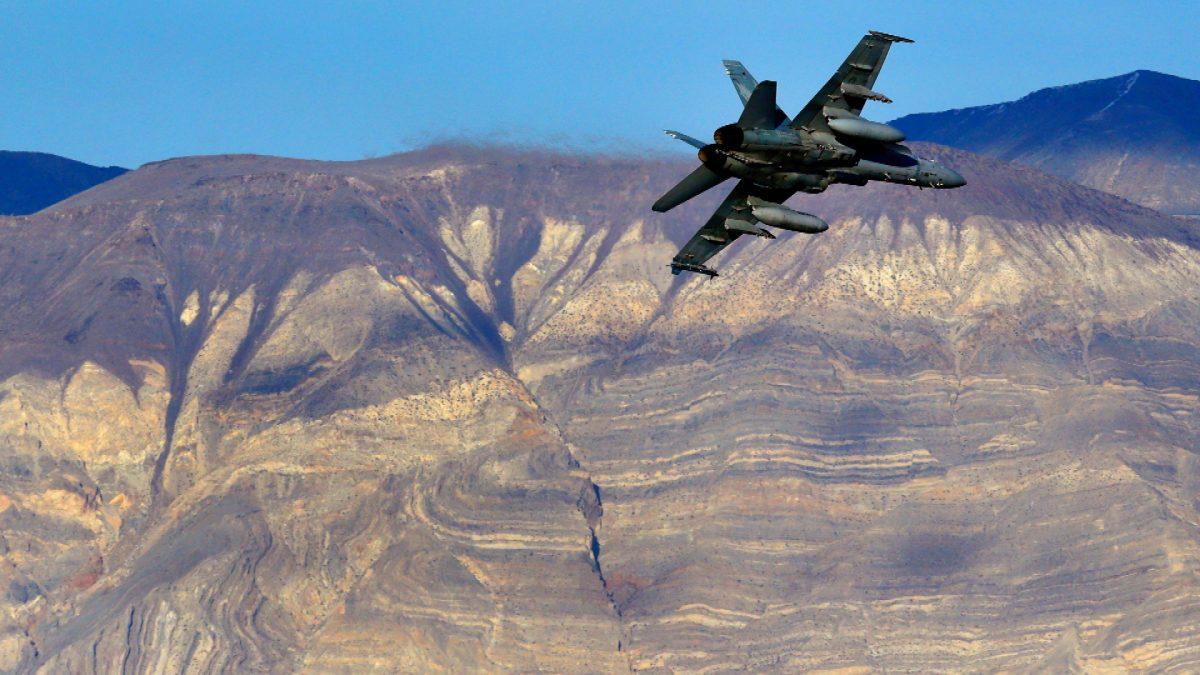 an F/A-18D Hornet from the VX-9 Vampire squadron at Naval Air Weapons Station China Lake, flies out of what is known as Star Wars Canyon toward the Panamint range in Death Valley National Park, Calif., on Feb 27, 2017. (AP File Photo/Ben Margot)