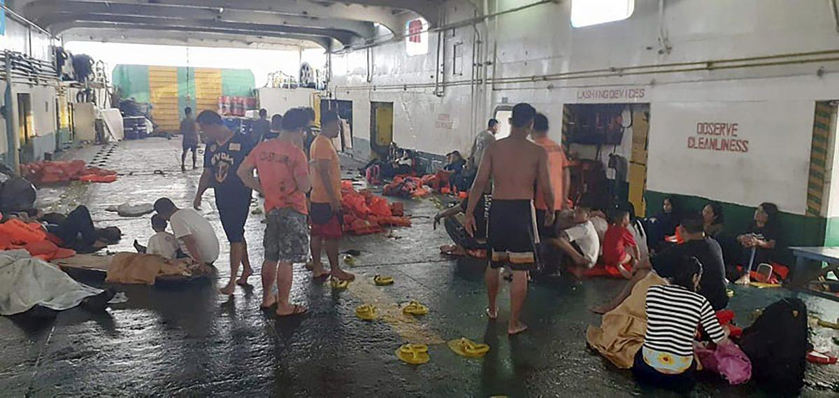In this photo provided by Philippine Coast Guard in Manila, rescued passengers of the ill-fated M/V Lite Ferry 16, are attended to by the coast guard rescuers and crew of responding vessels, on a ferry which responded to the incident, following an overnight ferry fire on Aug. 28, 2019, off Dapitan city in Zamboanga del Norte province in southern Philippines. (Philippine Coast Guard via AP)