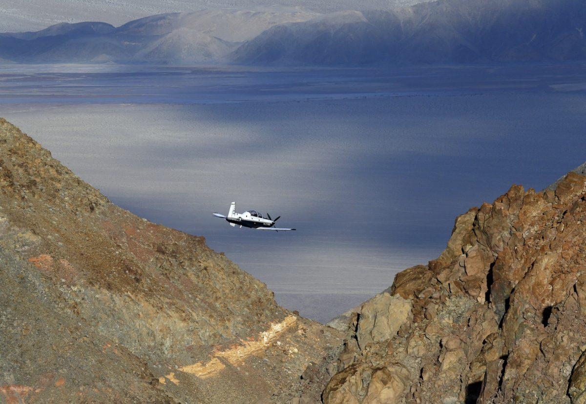 A Beechcraft T-6 Texan II trainer from Sheppard AFB Texas flies out of what is known as Star Wars Canyon, a rugged area over Death Valley National Park in the California desert that is a training area for military aviators on Feb 27, 2017. (AP File Photo/Ben Margot)