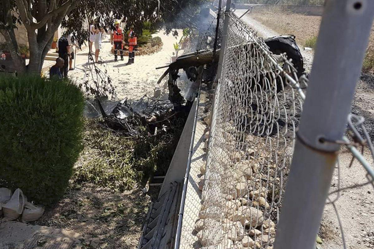 This photo provided by Incendios f.Baleares shows wreckage by a fence near Inca in Palma de Mallorca, Spain on Aug. 25, 2019. (Incendios f.Baleares via AP)