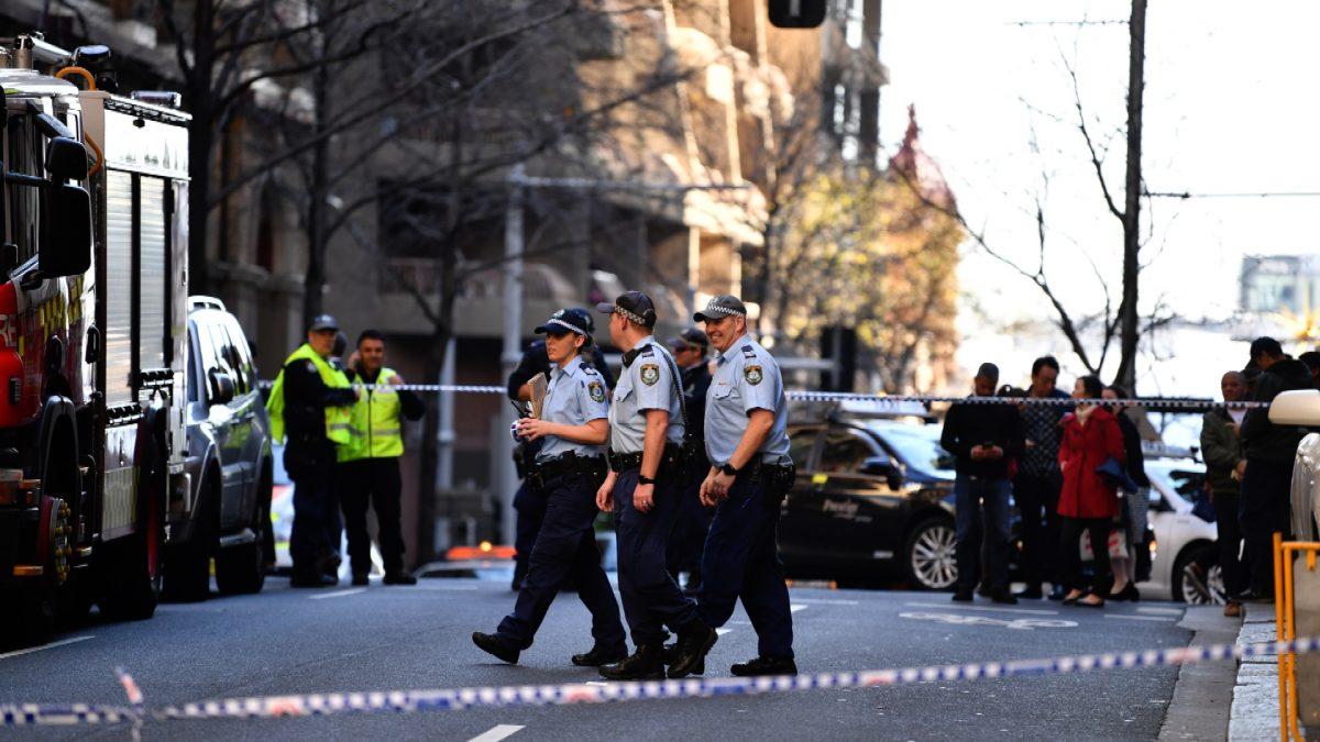 Police officers investigate a scene following reports of a stabbing in Sydney, Australia on Aug. 13, 2019. (Dean Lewis/AAP/via Reuters)