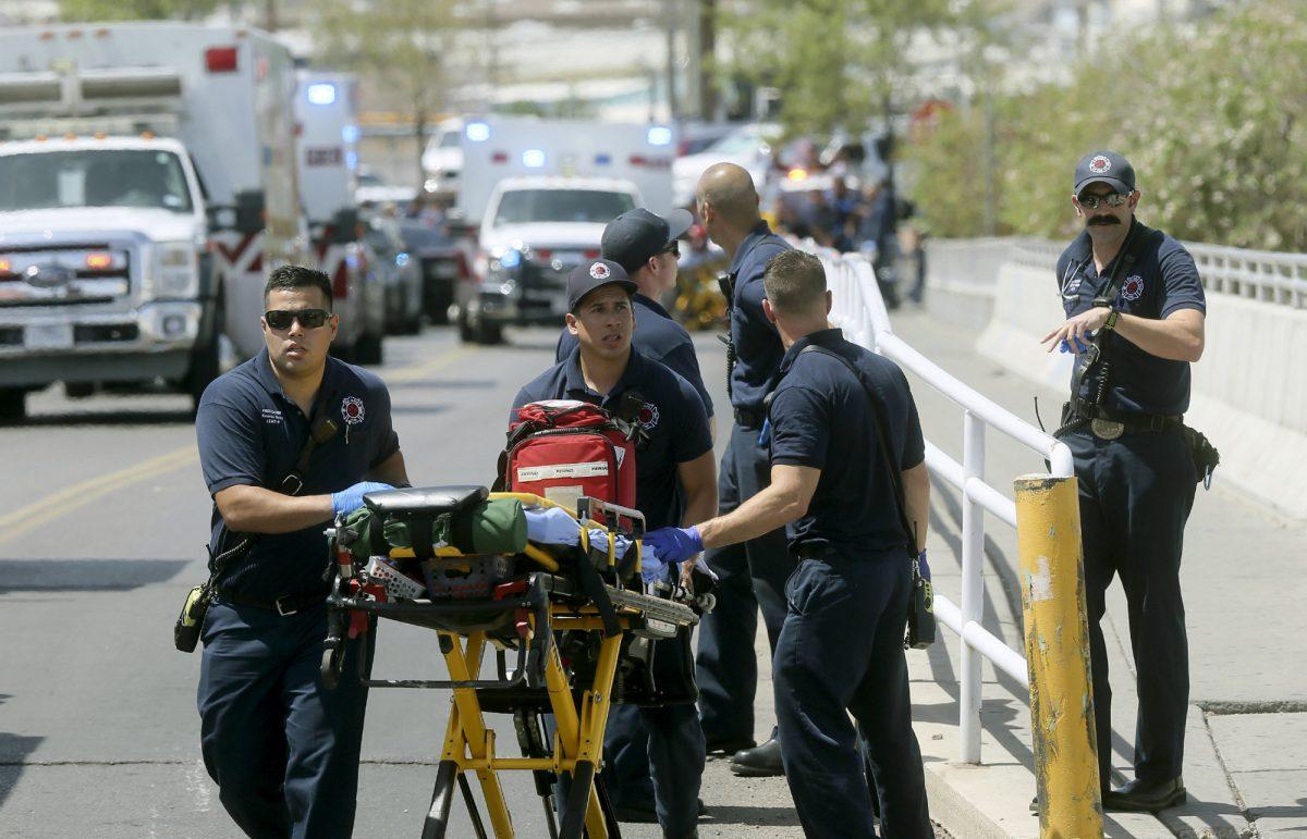 El Paso Fire Medical personnel arrive at the scene of a shooting at a Walmart near the Cielo Vista Mall in El Paso, Texas, on Aug. 3, 2019. (Mark Lambie/The El Paso Times via AP)