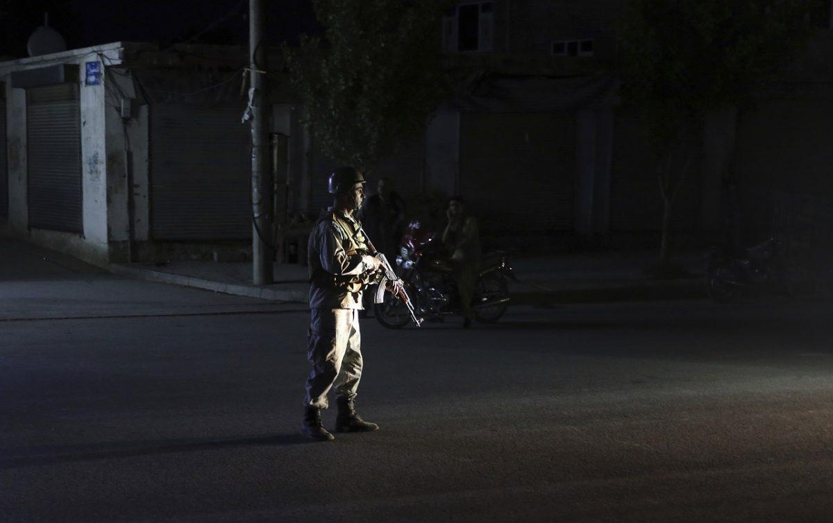 An Afghan police man stand guard outside the wedding hall after an explosion in Kabul, Afghanistan, on Aug. 18, 2019. (Rafiq Maqbool/AP Photo)