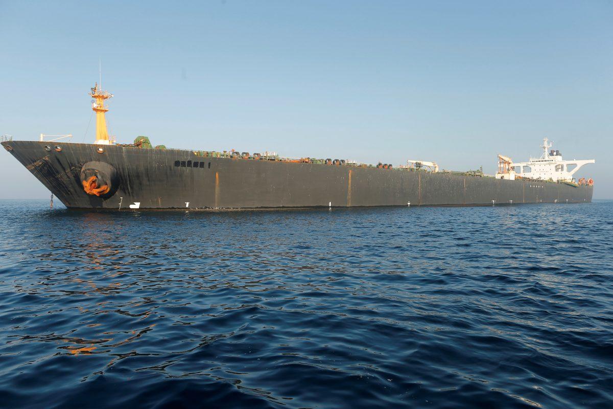 The name of Iranian oil tanker Grace 1 is seen removed as it sits anchored after the Supreme Court of the British territory lifted its detention order, in the Strait of Gibraltar, southern Spain, on Aug. 16, 2019. (Reuters/Jon Nazca)