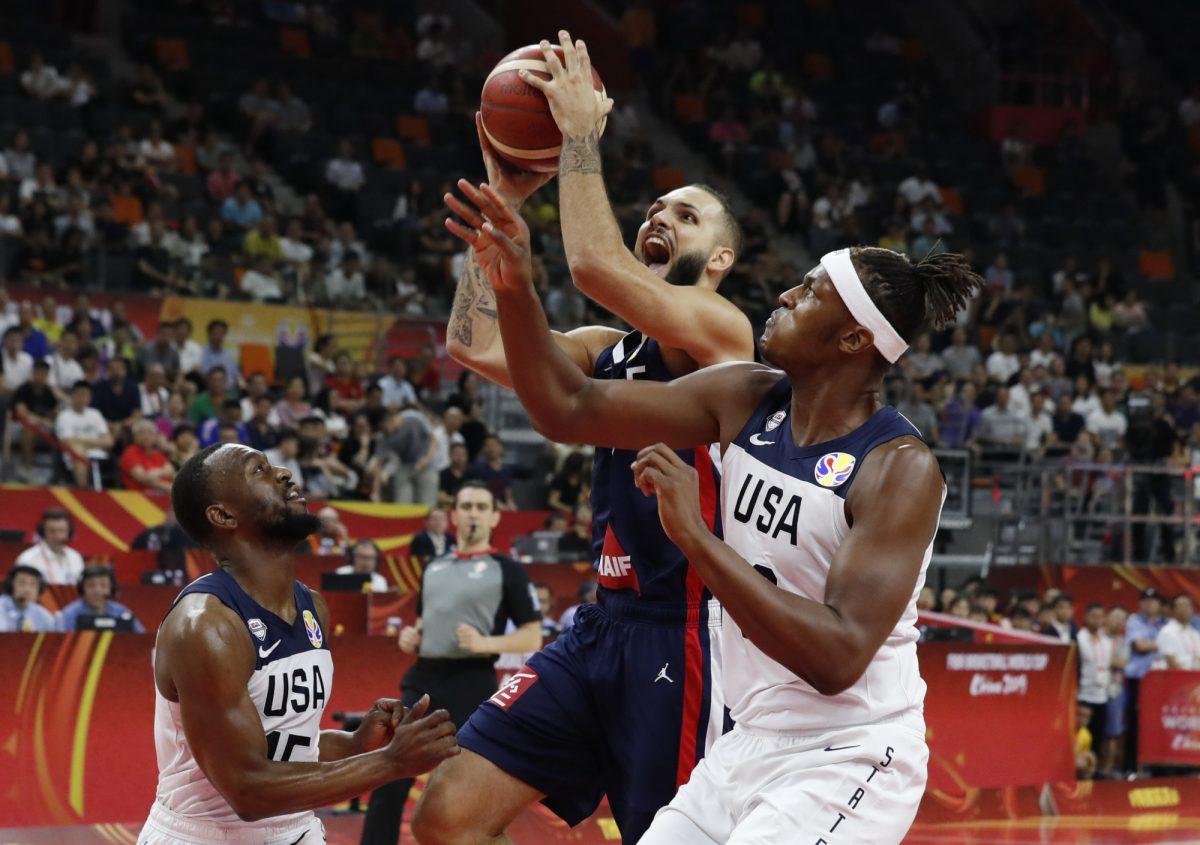 Basketball - FIBA World Cup - Quarter Finals - United States v France - Dongguan Basketball Center, Dongguan, China - Sept. 11, 2019. France's Evan Fournier in action with Myles Turner and Kemba Walker of the U.S. (Kim Kyung-Hoon/Reuters)