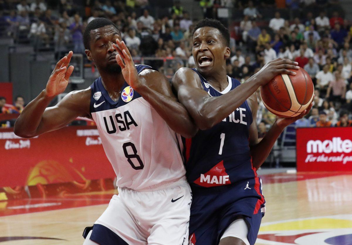 Basketball - FIBA World Cup - Quarter Finals - United States v France - Dongguan Basketball Center, Dongguan, China - Sept. 11, 2019. France's Frank Ntilikina in action with Harrison Barnes of the U.S. (Kim Kyung-Hoon/Reuters)