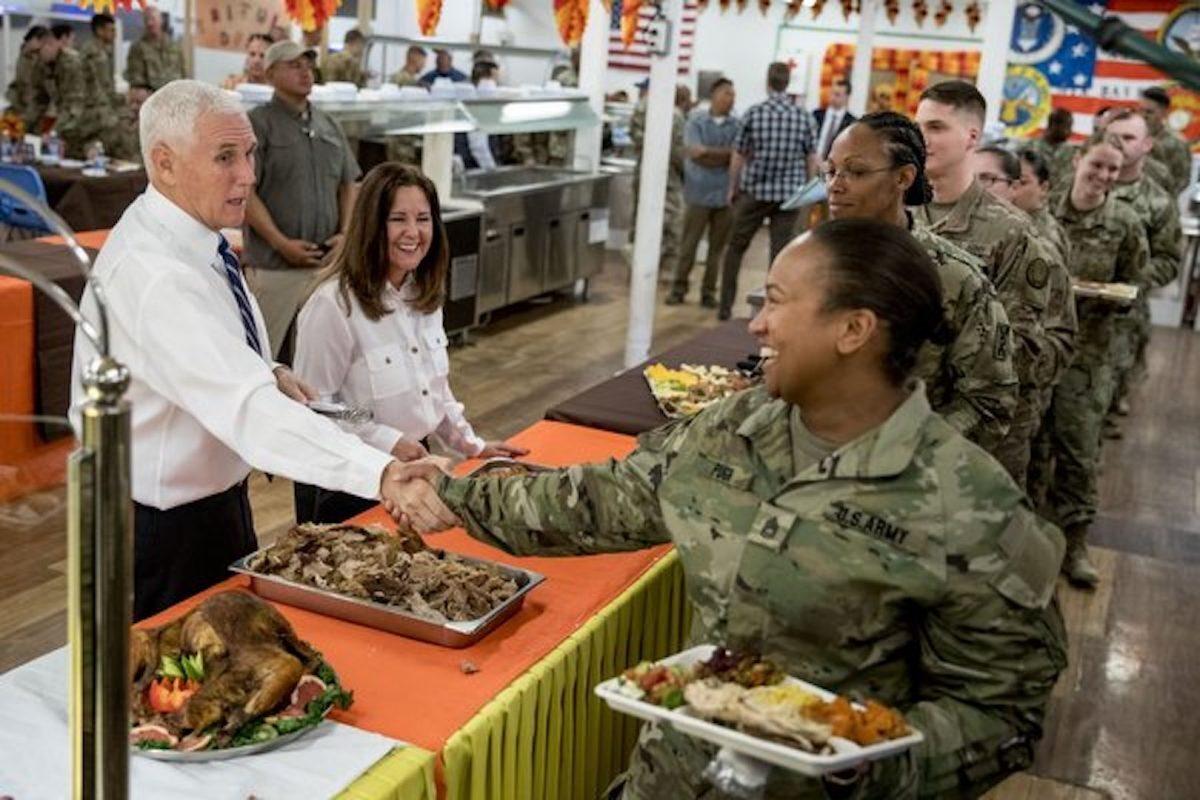 Vice President Mike Pence and his wife Karen Pence, second from left, serve turkey to troops at Al Asad Air Base, Iraq on Nov. 23, 2019. (Andrew Harnik/AP Photo)