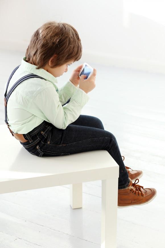 Kids are becoming more hunched over than their parents. (Yeko Photo Studio/Shutterstock)