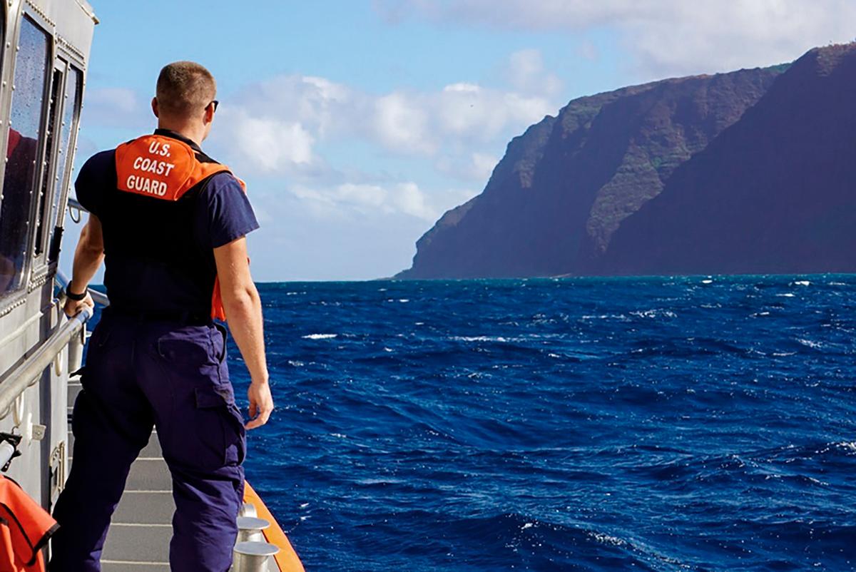 Coast Guard Cutter William Hart moves toward the Na Pali Coast on the Hawaiian island of Kauai on Dec. 27, 2019, the day after a tour helicopter disappeared with seven people aboard. (MK3 Forest Herring/U.S. Coast Guard via AP)