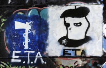 Picture shows graffiti displaying the logo of Basque separatist armed group ETA, and an ETA activist's head in the northern Spanish Basque village of Oquendo, on March 23, 2010. The Basque terrorist group ETA announced a permanent halt of attacks on Jan. 10, but was faced cool skepticism by the Spanish government. (Rafa Rivas/Getty Images )