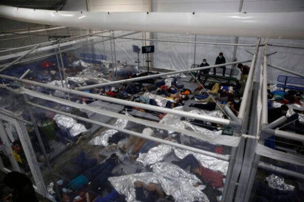 Young children lie inside a pod at the Department of Homeland Security holding facility run by the Customs and Border Patrol (CBP) in Donna, Texas, on March 30, 2021. (Dario Lopez-Mills/Pool/Getty Images)