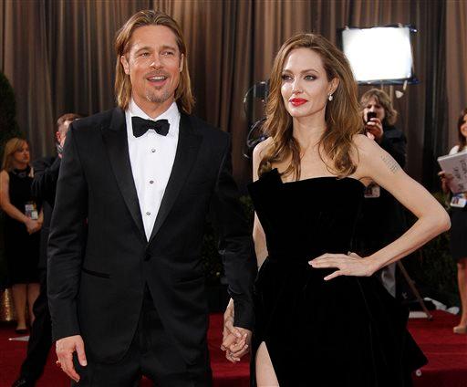 Actress Angelina Jolie, right, and actor Brad Pitt at the 84th Academy Awards in the Hollywood section of Los Angeles, Feb. 26, 2012. (AP Photo/Amy Sancetta)
