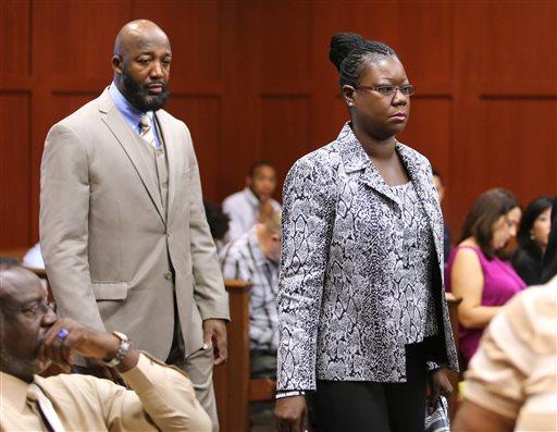 The parents of Trayvon Martin, Tracy Martin and Sybrina Fulton, arrive at the trial for George Zimmerman in Seminole Circuit Court, in Sanford, Fla., Tuesday, July 9, 2013. Zimmerman is charged with second-degree murder in the fatal shooting of Trayvon Martin, an unarmed teen, in 2012. (AP Photo/Orlando Sentinel, Joe Burbank, Pool)
