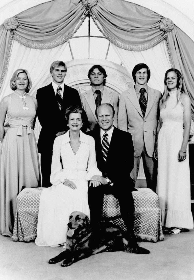 President Gerald Ford and First Lady Betty Ford pose with family members and their dog, a Golden Retriever named Liberty, at the White House in 1975. (AP Photo)